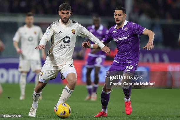 Rolando Mandragora of ACF Fiorentina battles for the ball with Hoiussem Aouar of AS Roma during the Serie A TIM match between ACF Fiorentina and AS...