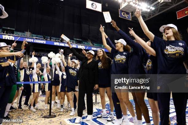 Players and cheerleaders of the Notre Dame Fighting Irish sing their Alma Mater following their 55-51 victory against the NC State Wolfpack in the...