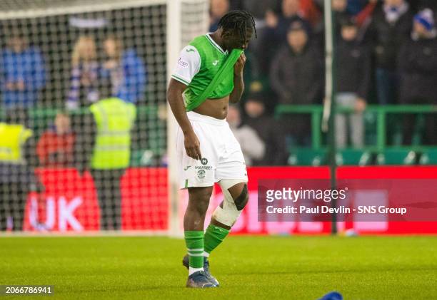 Hibernian's Rocky Bushiri looks dejected at full time during a Scottish Cup Quarter Final match between Hibernian and Rangers at Easter Road Stadium,...
