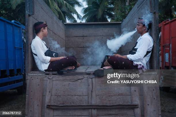 Balinese Hindus rest during the purification ritual known as Melasti, before Nyepi, the day of silence that marks the new year in the Balinese Hindu...