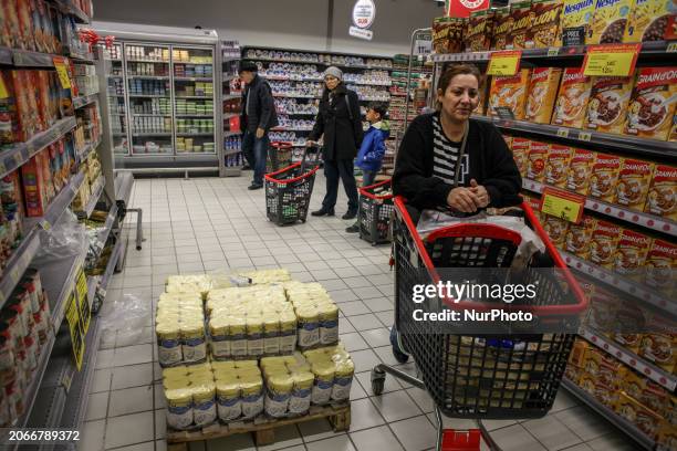 Tunisian customers are shopping for food at a supermarket in the Ariana district in Tunis, Tunisia, on March 10, 2024. Tunisia is being hit by a...