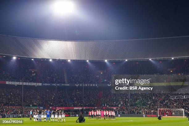 Players of Heracles Almelo and Feyenoord during a moment of silence in commemoration of Kees Rijvers during the Dutch Eredivisie match between...