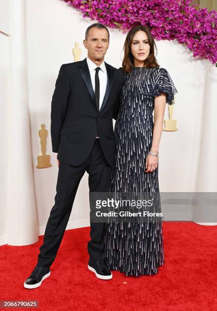 John Battsek and Sarah Thompson at the 96th Annual Oscars held at at the Dolby Theatre on March 10, 2024 in Los Angeles, California.