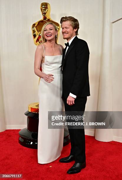 Actress Kirsten Dunst and US actor Jesse Plemons attend the 96th Annual Academy Awards at the Dolby Theatre in Hollywood, California on March 10,...