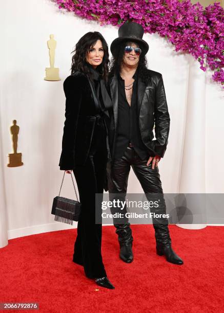 Meegan Hodges and Slash at the 96th Annual Oscars held at at the Ovation Hollywood on March 10, 2024 in Los Angeles, California.