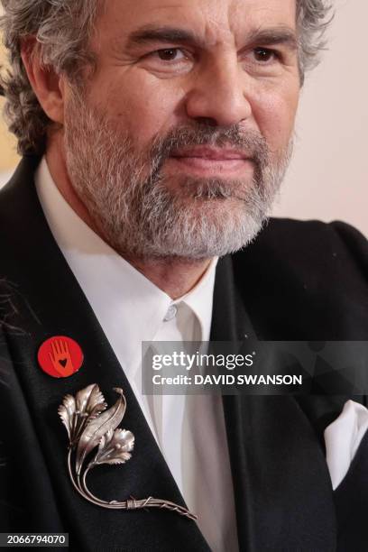 Actor Mark Ruffalo wears an "Artists4Ceasefire" pin, calling for de-escalation and ceasefire in Gaza and Israel as he attends the 96th Annual Academy...