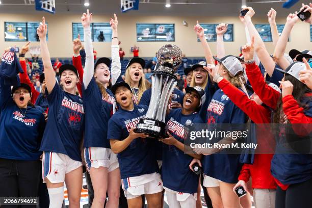 The Richmond Spiders celebrate winning the A10 Women's Basketball Tournament Championship Game against the Rhode Island Rams at Henrico Sports &...