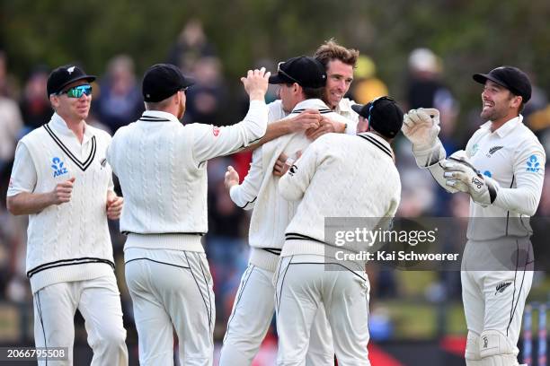 Tim Southee of New Zealand is congratulated by team mates after dismissing Travis Head of Australia during day four of the Second Test in the series...