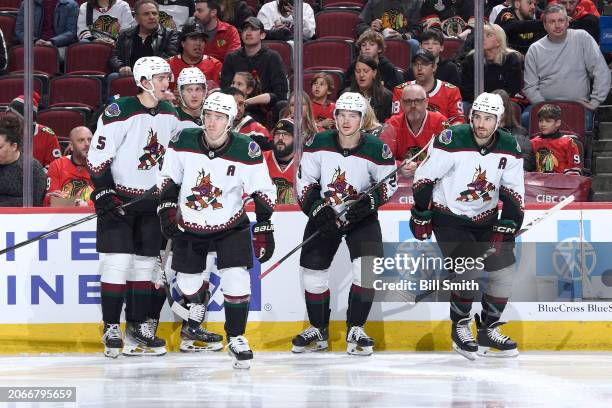 Clayton Keller of the Arizona Coyotes celebrates with teammates after scoring against the Chicago Blackhawks in the second period at the United...