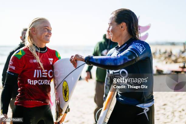 Sally Fitzgibbons of Australia and Tatiana Weston-Webb of Brazil after surfing in Heat 4 of the Round of 16 at the MEO Rip Curl Pro Portugal on March...