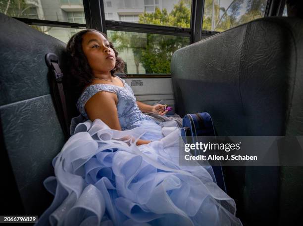 North Hollywood, CA Film participant and Palms Middle School sixth-grader Porché Brinker looks out the window while bracing her violin as she rides a...