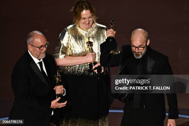 British makeup artists Josh Weston , Nadia Stacey and Mark Coulier accept the award for Best Makeup and Hairstyling onstage for "Poor Things" during...