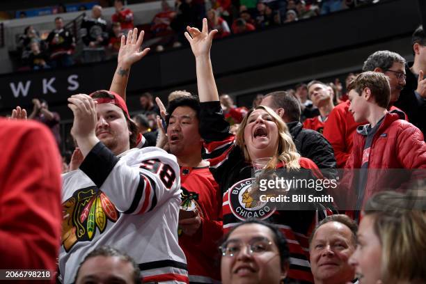 Fans cheer after the Chicago Blackhawks score against the Arizona Coyotes at the United Center on March 10, 2024 in Chicago, Illinois.