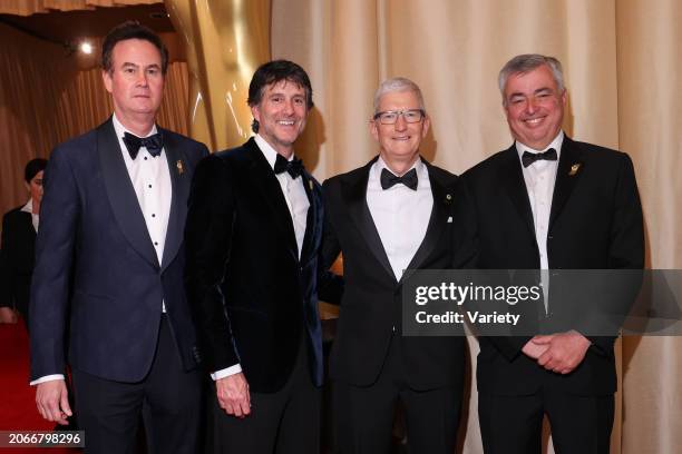 Zack Van Amburg, Jamie Erlicht, Tim Cook and Eddy Cue at the 96th Annual Oscars held at Ovation Hollywood on March 10, 2024 in Los Angeles,...