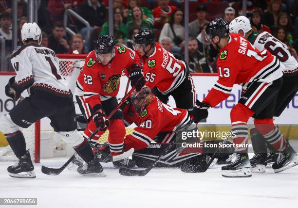 Dylan Guenther of the Arizona Coyotes scores a goal during the second period against the Chicago Blackhawks at the United Center on March 10, 2024 in...