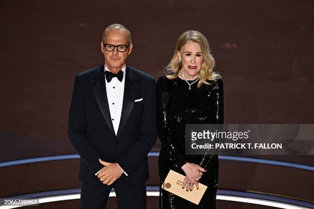 Actor Michael Keaton and Canadian-US Catherine O'Hara present the award for Best Makeup and Hairstyling onstage during the 96th Annual Academy Awards...
