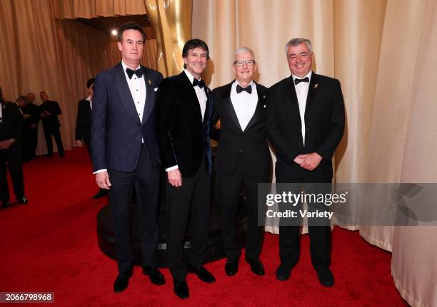 Zack Van Amburg, Jamie Erlicht, Tim Cook and Eddy Cue at the 96th Annual Oscars held at Ovation Hollywood on March 10, 2024 in Los Angeles,...