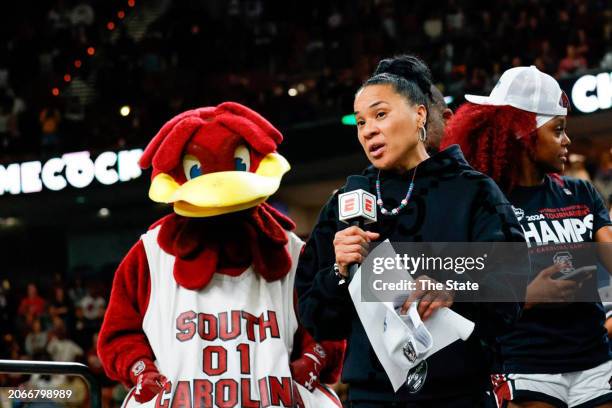 University of South Carolina head coach Dawn Staley speaks to fans, apologizing for the mid-court altercation after the Gamecocks beat LSU to win the...