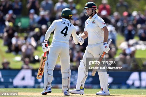 Mitchell Marsh of Australia is congratulated by Alex Carey of Australia after scoring a half century during day four of the Second Test in the series...