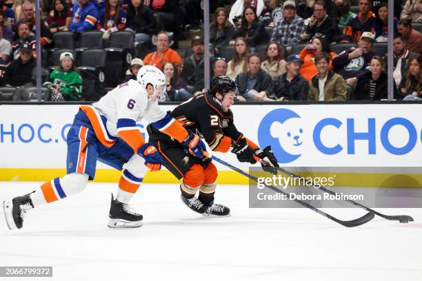 Ryan Pulock of the New York Islanders and Mason McTavish of the Anaheim Ducks battle for the puck during the first period at Honda Center on March...