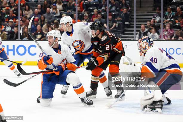 Kyle Palmieri of the New York Islanders, Gustav Lindstrom of the Anaheim Ducks and Ryan Pulock of the New York Islanders battle for position during...