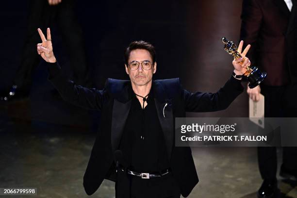 Actor Robert Downey Jr. Accepts the award for Best Actor in a Supporting Role for "Oppenheimer" onstage during the 96th Annual Academy Awards at the...