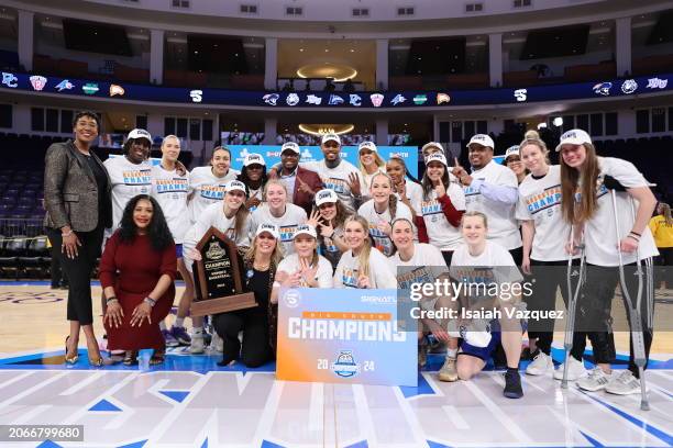 The Presbyterian Blue Hose celebrate after defeating the Radford Highlanders in the Big South Women's Basketball Championship at High Point...