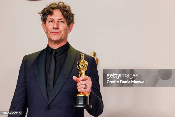 Hollywood, CA English director Jonathan Glazer poses in the press room with the Oscar for Best International Feature Film for "The Zone of Interest,"...