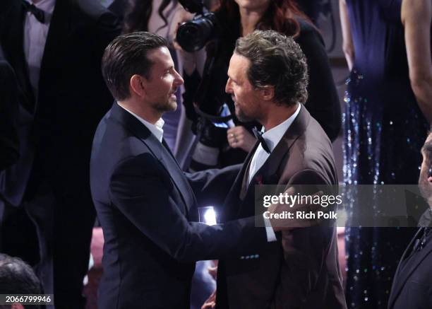 Bradley Cooper and Matthew McConaughey at the 96th Annual Oscars held at Dolby Theatre on March 10, 2024 in Los Angeles, California.