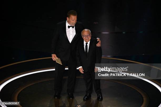 Actor Danny DeVito and Austrian-US actor an former Governor of California Arnold Schwarzenegger present the award for Best Visual Effects onstage...