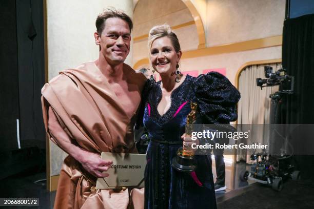 Hollywood, CA John Cena and Holly Waddington back stage during the the 96th Annual Academy Awards in Dolby Theatre at Hollywood & Highland Center in...