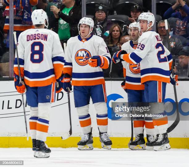 Brock Nelson of the New York Islanders celebrates his goal with teammates during the first period against the Anaheim Ducks at Honda Center on March...