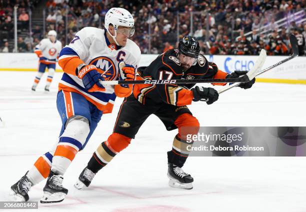 Anders Lee of the New York Islanders and Alex Killorn of the Anaheim Ducks battle for position during the second period at Honda Center on March 10,...