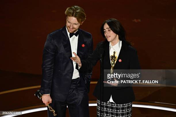 Singer-songwriter Billie Eilish and US singer-songwriter Finneas O'Connell accept the award for Best Original Song for "What Was I Made For" from...