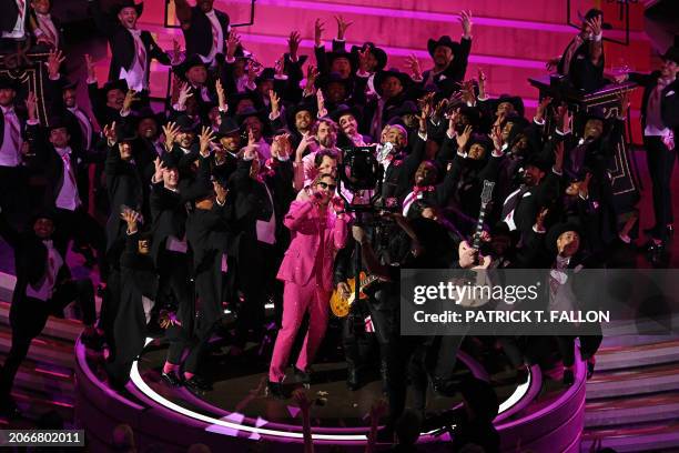 Canadian actor Ryan Gosling performs "I'm Just Ken" from "Barbie" onstage during the 96th Annual Academy Awards at the Dolby Theatre in Hollywood,...