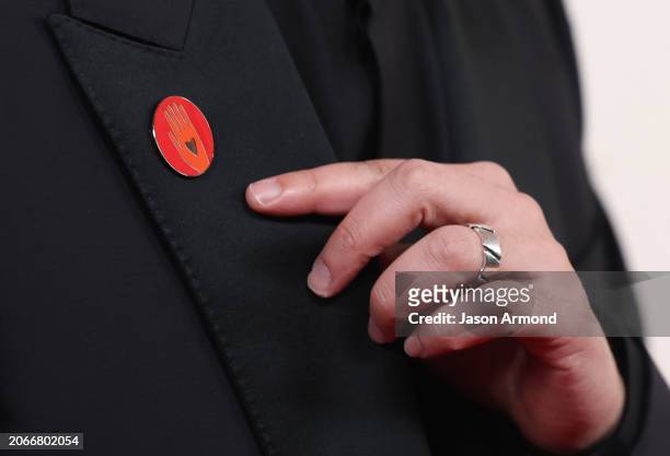 Hollywood, CA A red pin worn to Call for a Cease-Fire in Gaza arriving on the red carpet at the 96th Annual Academy Awards in Dolby Theatre at...