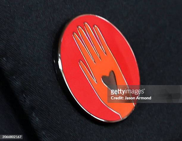 Hollywood, CA A red pin worn to Call for a Cease-Fire in Gaza arriving on the red carpet at the 96th Annual Academy Awards in Dolby Theatre at...