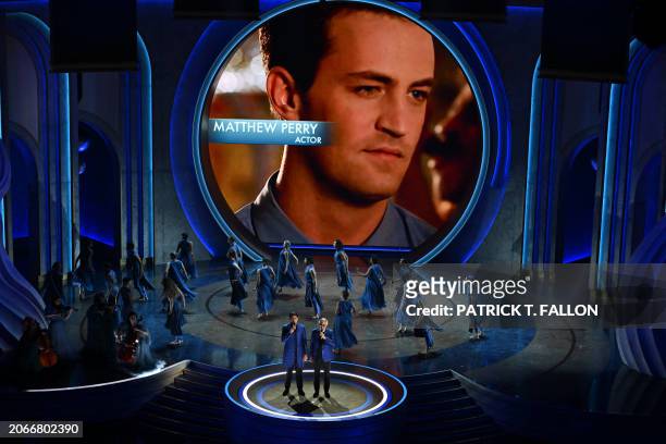 Late US-Canadian actor Matthew Perry is shown on screen as Italian tenor Andrea Bocelli and his son Italian singer Matteo Bocelli perform during an...