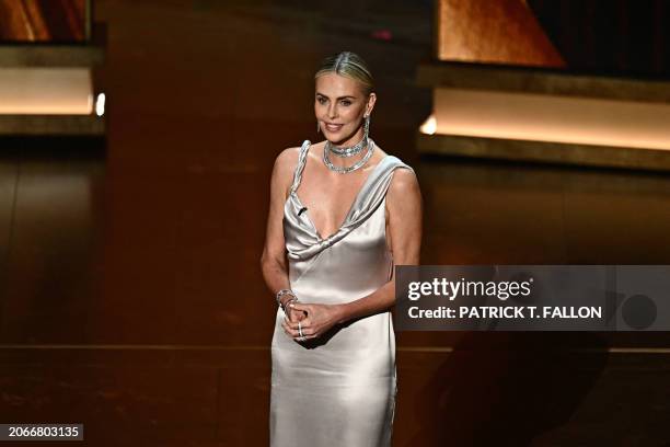 South African actress Charlize Theron presents the award for Best Actress in a Leading Role onstage during the 96th Annual Academy Awards at the...