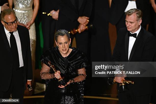 Producers of "Oppenheimer" British film producer Emma Thomas , US film producer Charles Roven and British filmmaker Christopher Nolan accept the...
