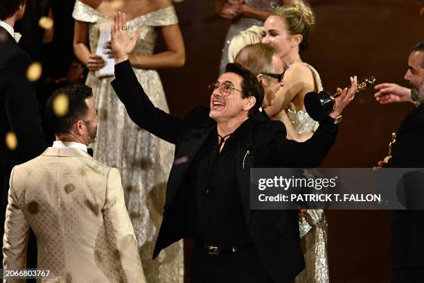 Actor Robert Downey Jr. Reacts onstage after "Oppenheimer" won the award for Best Picture onstage during the 96th Annual Academy Awards at the Dolby...