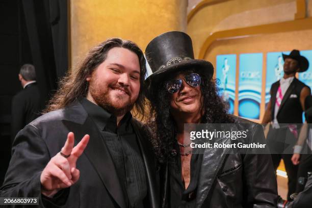 Hollywood, CA Wolfgang Van Halen, left, and Slash, of the band Guns 'N Roses, right, back stage during the the 96th Annual Academy Awards in Dolby...