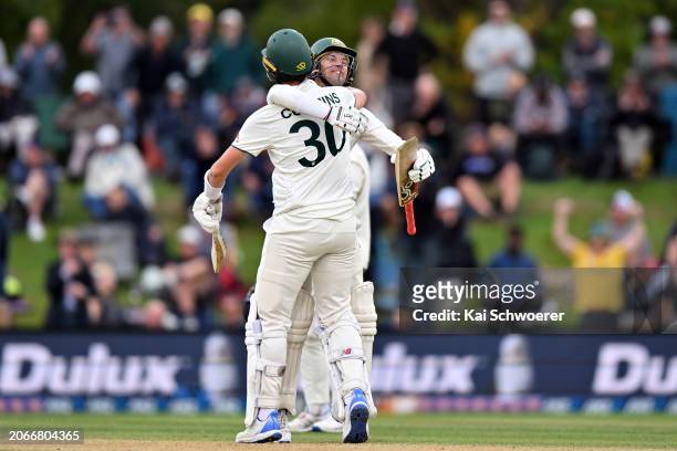 Pat Cummins and Alex Carey of Australia celebrate their win during day four of the Second Test in the series between New Zealand and Australia at...