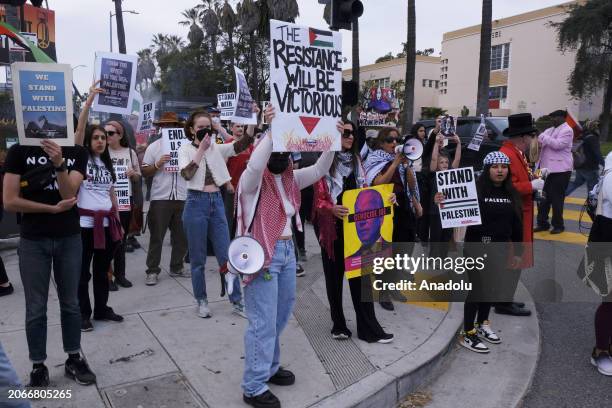 Palestine protesters wave flags and carry signs during the Oscars Awards in Hollywood, California, United States on March 10, 2024. Pro-Palestinian...