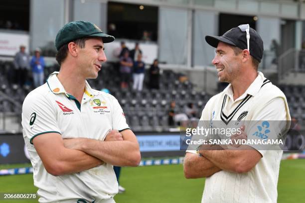 Australia's Pat Cummins talks with New Zealand's Tim Southee after Australia's victory on day four of the second Test cricket match between New...