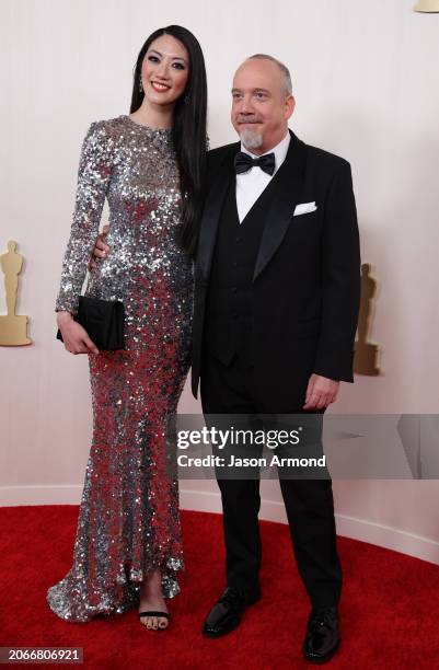 Hollywood, CA Clara Wong and Paul Giamatti arriving on the red carpet at the 96th Annual Academy Awards in Dolby Theatre at Hollywood & Highland...