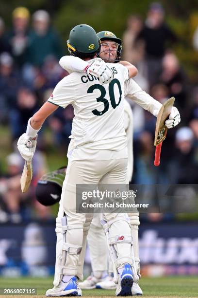 Pat Cummins and Alex Carey of Australia celebrate their win during day four of the Second Test in the series between New Zealand and Australia at...