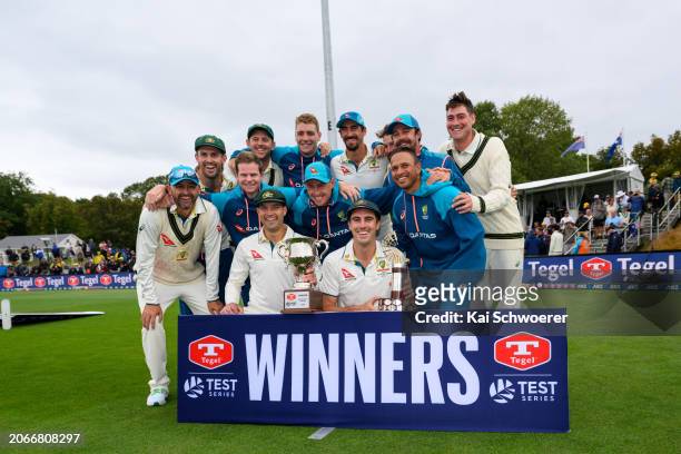 Captain Pat Cummins of Australia and his team mates pose with the trophy after their series win during day four of the Second Test in the series...