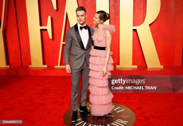 Actress Allison Williams with German actor Alexander Dreymon attend the Vanity Fair Oscars Party at the Wallis Annenberg Center for the Performing...