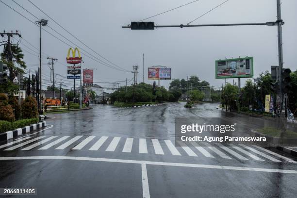 An empty street is seen during the day of silence of Nyepi Day on March 11, 2024 in Jimbaran, Bali, Indonesia. Nyepi is a holy day that marks the...